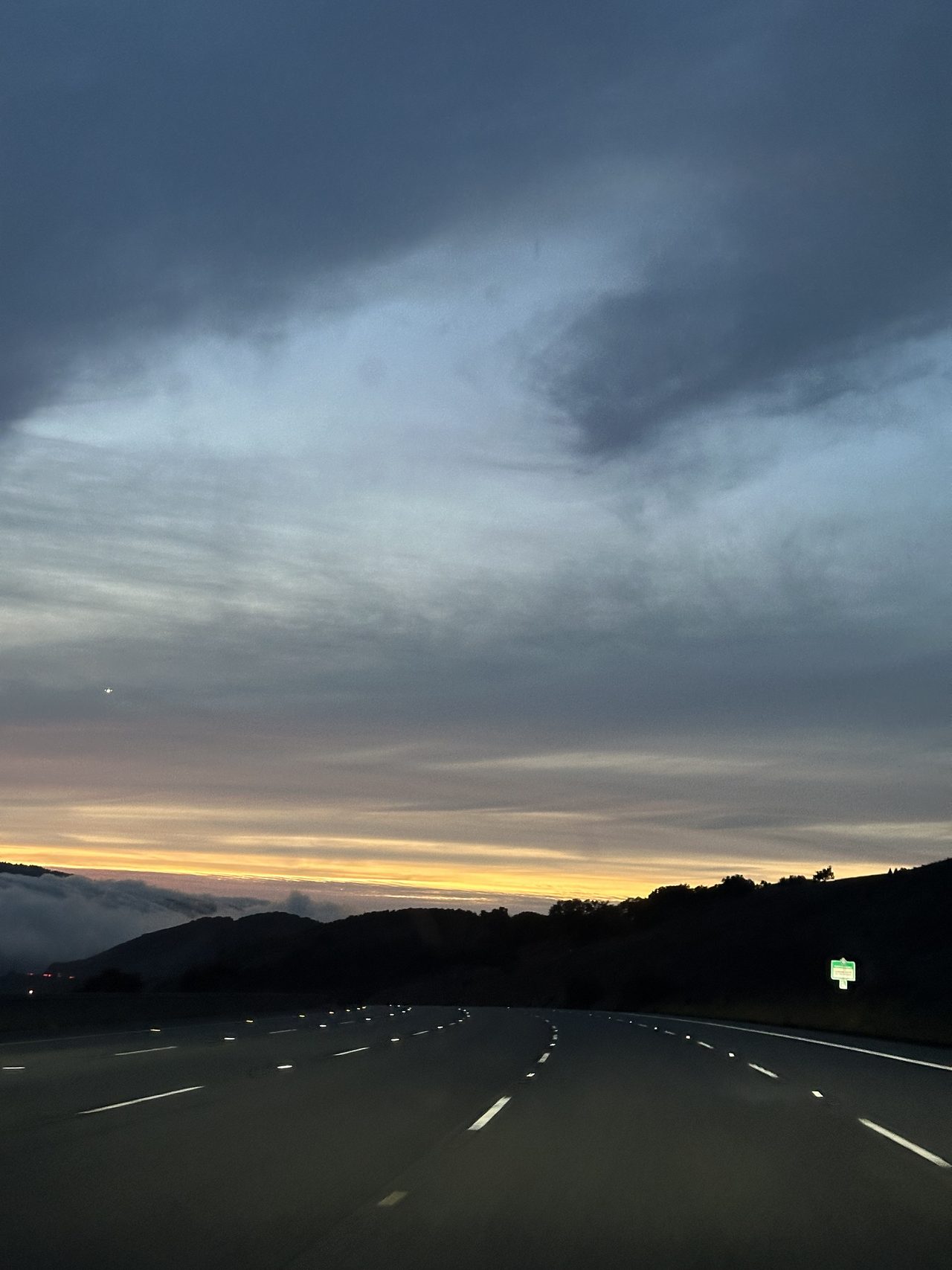 280 empty, fog banked up on the ridge, one star already out.